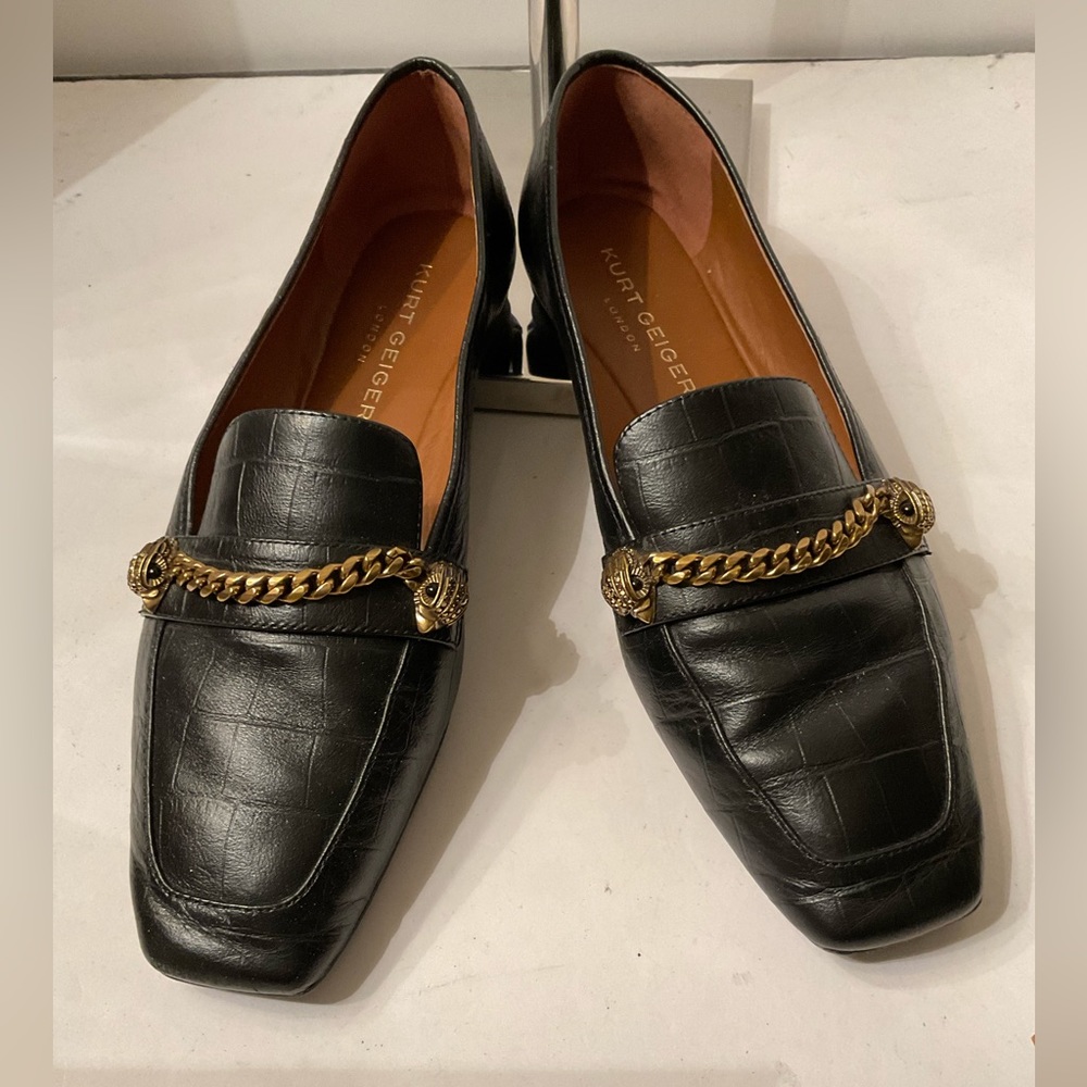 Kurt Geiger black flats embellished with eagles and gold chain